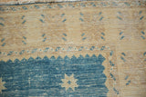 Distressed vintage Oushak rug, denim blue stepped outlining on an antique ivory field.