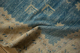 Distressed denim blue and antique ivory Oushak rug pile with visible wear.