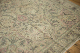 Low pile texture of a vintage Kayseri carpet showing scrolling vines in dusty rose and silver.