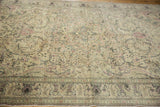 Detailed angle of a distressed Kayseri carpet showing the floral field's soft, worn texture.