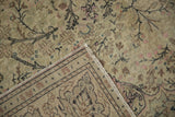 Construction detail of a vintage Kayseri rug, showing its hand-knotted reverse and secured side cord.