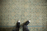 Overhead view of a distressed Kayseri carpet's low-pile texture and allover trellis pattern.
