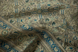 Worn pile of a vintage Kayseri carpet revealing knot heads and soft, time-softened colors.
