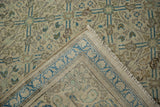 View of the hand-knotted foundation and bound edge on a distressed Turkish Kayseri carpet.