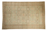 Distressed Sparta carpet with an allover geometric design in sea foam green, ivory, and terracotta.