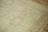 Angled view of a distressed Sparta carpet's low-pile texture and geometric shield design.