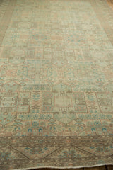 Angled view of a distressed Sparta carpet highlighting the even, low-pile texture and repeating geometric field.