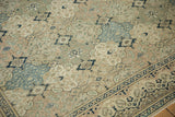Distressed Kayseri carpet's repeating panel design in soft slate blue, sand, and navy blue.