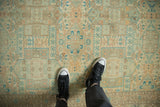 Evenly worn low pile of a vintage Sparta carpet with geometric shield designs in seafoam and copper tones.