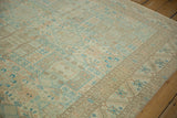 Close view of a Sparta carpet's worn pile and geometric shield medallion motifs.