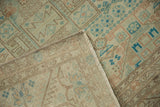 Tightly woven foundation and machine-bound edge of a distressed vintage Sparta carpet.