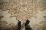 Evenly worn low pile texture on a distressed vintage Kars carpet in neutral sand tones.