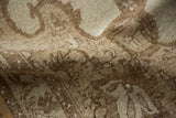 Even wear on the hand-knotted pile of a vintage Kars rug in beige and pale brown.