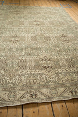 Low angle view showing the distressed texture and geometric patterns of a vintage Sparta carpet.