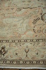 Evenly worn, low pile on a vintage Kayseri with feathered floral designs in soft, neutral tones.
