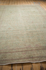 Low angled view showing the mostly even wear and soft, distressed texture of the vintage Kayseri carpet.