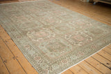 Angled view of a distressed Sparta carpet displaying its triple columns of geometric guls.