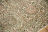 Mostly even wear showing knot heads on the geometric gul patterns in dusty rose and ivory.