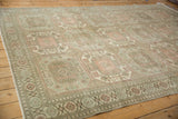 Angled view of the distressed Sparta carpet's geometric guls and low-pile texture.