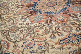 Vintage Kayseri rug: Ivory field, spiraled tendrils, terracotta, and sapphire blue motifs.