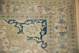 Vintage Kayseri rug corner showing intricate floral borders and even wear across the pile.