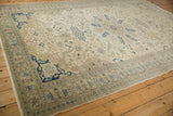 Angled view of the distressed Kayseri carpet's decorative corner in navy blue and ivory.