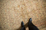 Kayseri rug's short pile showing cream, sandalwood, aubergine floral vines and blossoms.