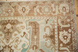 Close-up of the distressed Sparta carpet's Herati border with heavy abrashes in brown and ivory.