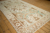 Low angle on a distressed Sparta carpet showing gentle color shifts from heavy abrashes.