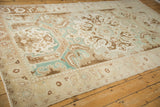 A low-angle view highlights the scrolled Rococo patterns and worn texture of the vintage carpet.