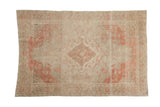 Distressed vintage hand-knotted Turkish Kayseri rug, muted beige with faded coral medallion.