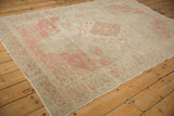 Distressed vintage Kayseri rug with faded pink patterns and textured, worn pile.