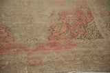 Distressed hand-knotted Turkish Kayseri rug detail with faded pink patterns and worn pile.