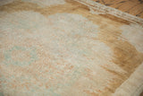 Softly distressed texture of a vintage Kars carpet showing an abrashed patina and low pile.