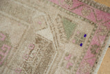 Detail of even wear to the knot heads and intact side cord on a vintage Kurd rug.