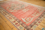 Vintage Distressed Kurdish carpet with faded terracotta field and muted floral-geometric border.