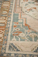 Textured pile of vintage Taspinar rug, showing distressed geometric motifs in teal, terracotta, and ivory.