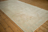 Mostly even wear and a low pile texture on this vintage distressed Oushak runner.