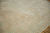 Angled view of the distressed Oushak pile, showing soft, mostly even wear to the knot heads.
