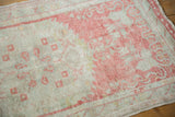 Softly distressed low pile of a vintage Oushak rug in raspberry blush and seafoam green.