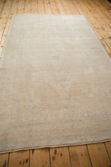 Reverse view of the hand-knotted foundation on a vintage distressed Turkish Oushak rug.