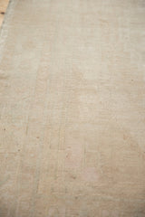 Even wear across the low pile to the knot heads of a distressed vintage Oushak rug.