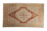 Vintage Distressed Oushak carpet, terracotta medallion, soft beige field, worn texture.