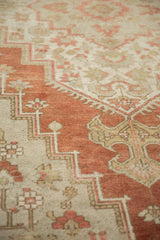 Vintage Distressed Oushak carpet featuring terra cotta and neutral geometric motifs.
