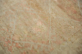 Distressed texture of a vintage Anatolian rug with low pile and visible knot heads.