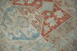 Even wear across the knot heads of a distressed Anatolian rug with geometric hook and latch motifs.