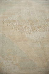 The soft, blanket-like texture and low pile of a distressed Turkish Oushak carpet.