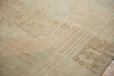 Heavy abrashes creating soft tonal shifts in the distressed, hand-knotted Oushak pile.