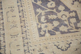 Hand-knotted Taspinar rug: distressed texture, faded ivory, dusty royal ink blue motifs.
