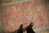 Distressed Oushak rug field showcasing interconnected botehs and abrash in blush, silver.